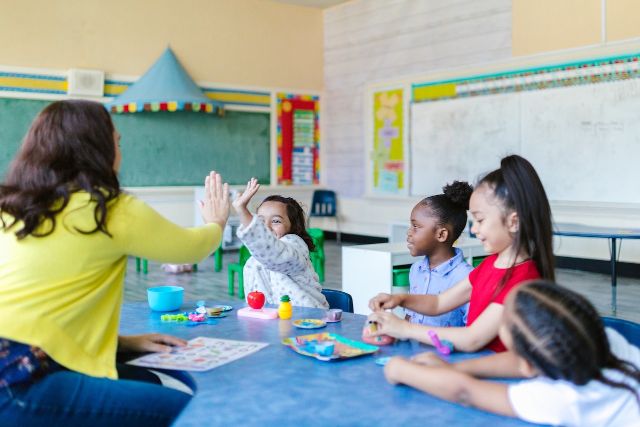 Teacher in classroom with students